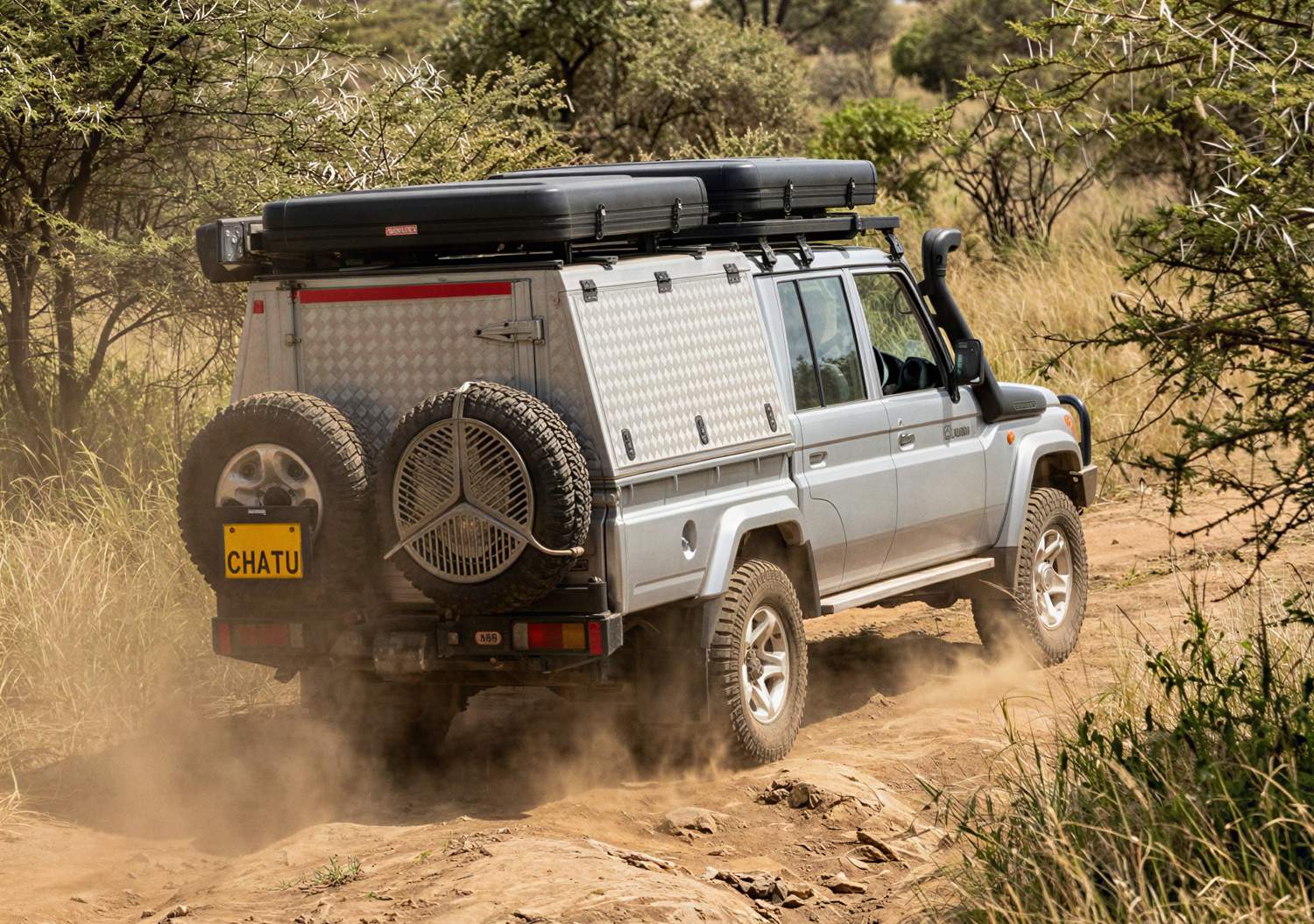 Chatu Driving down the path in the African bush